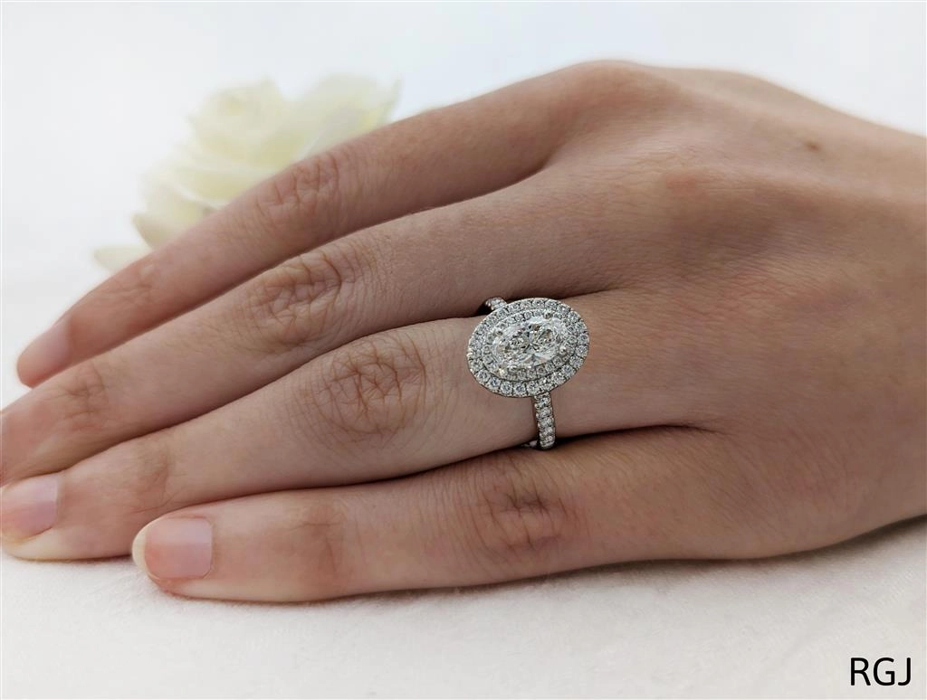 The Skye Duo Platinum 1.01ct Oval Cut Diamond Engagement Ring With 0.61ct Double Diamond Halo And Diamond Set Shoulders