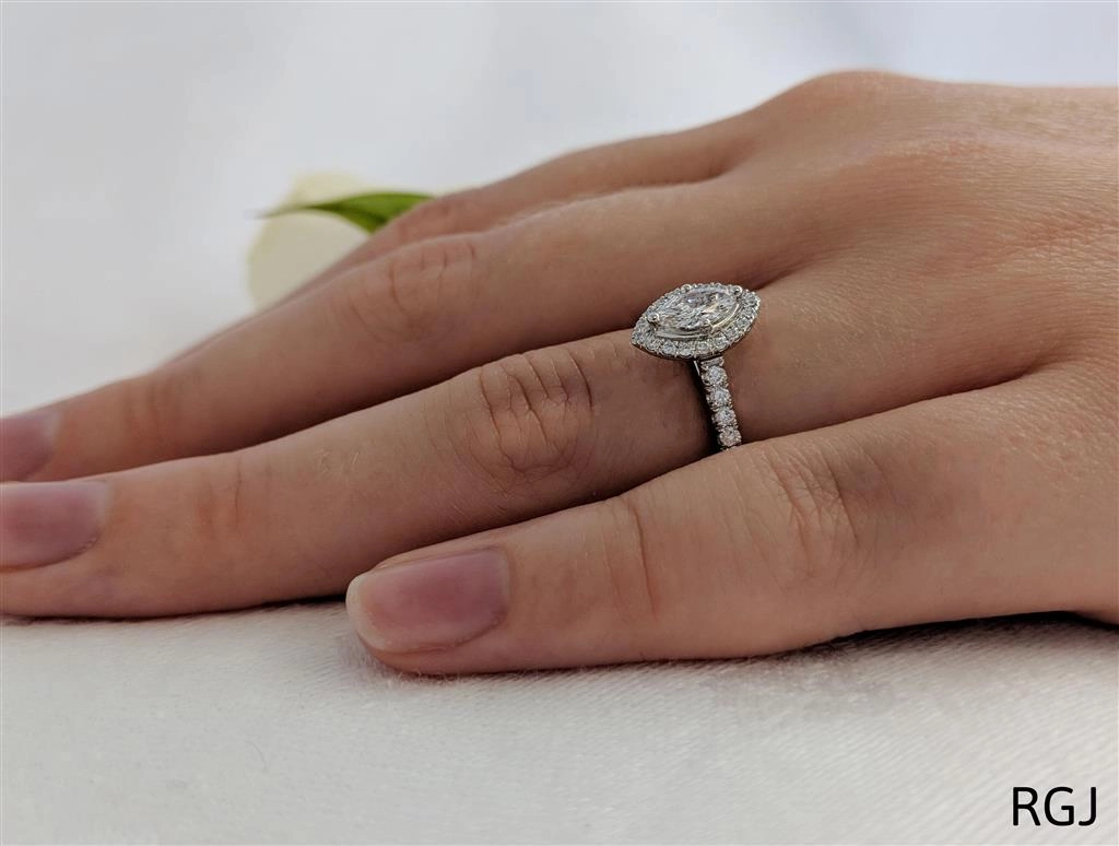 The Skye Platinum 0.30ct Marquise Cut Diamond Engagement Ring With 0.27ct Diamond Halo And Diamond Set Shoulders