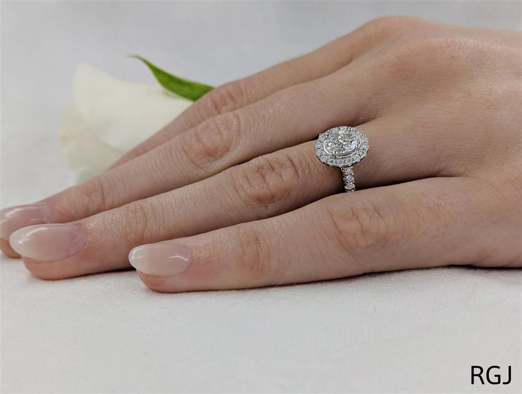 The Skye Platinum 0.50ct Oval Cut Diamond Engagement Ring with 0.33ct Diamond Halo And Diamond Set Shoulders