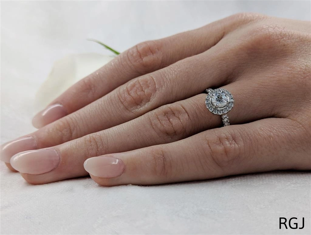 The Skye Platinum 0.50ct Round Brilliant Cut Diamond Engagement Ring With 0.31ct Diamond Halo And Diamond Set Shoulders