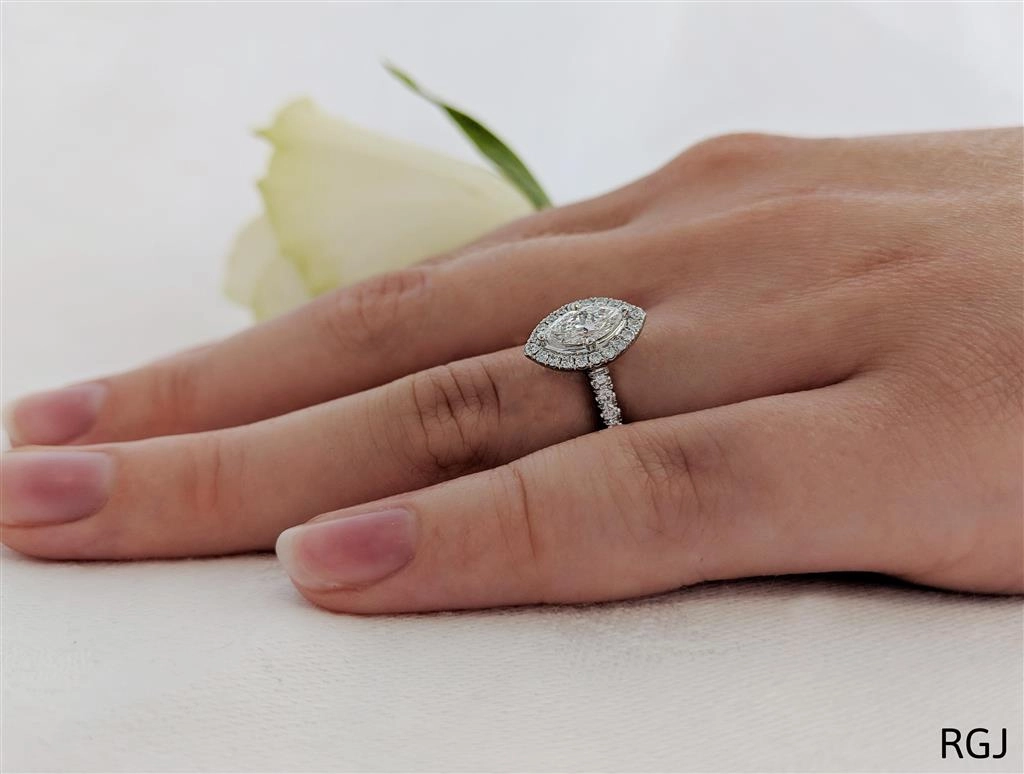 The Skye Platinum 0.51ct Marquise Cut Diamond Engagement Ring With 0.35ct Diamond Halo And Diamond Set Shoulders