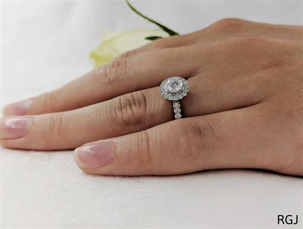 The Skye Platinum 0.51ct Round Brilliant Cut Diamond Engagement Ring With 0.28ct Diamond Halo And Diamond Set Shoulders