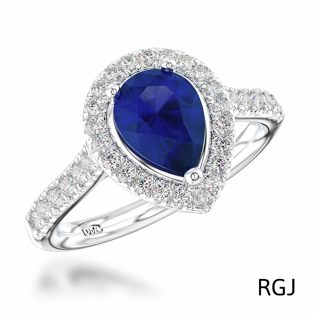 The Skye Platinum 0.76ct Pear Cut Blue Sapphire Ring With 0.33ct Diamond Halo And Diamond Set Shoulders