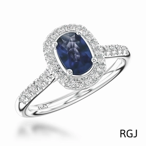The Skye Platinum 1.81ct Cushion Cut Blue Sapphire Ring With 0.43ct Diamond Halo And Diamond Set Shoulders