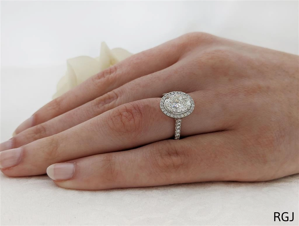 The Skye Platinum 2.01ct Oval Cut Diamond Engagement Ring With 0.44ct Diamond Halo And Diamond Set Shoulders