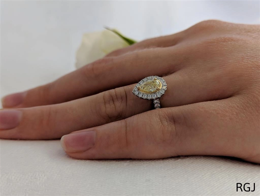 The Skye Platinum And 18ct Yellow Gold 0.39ct Pear Cut Yellow Diamond Engagement Ring With 0.27ct Diamond Halo And Diamond Set Shoulders