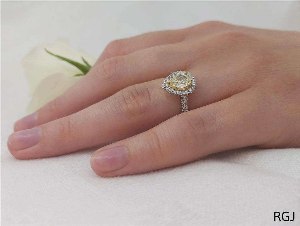 The Skye Platinum And 18ct Yellow Gold 0.57ct Pear Cut Yellow Diamond Engagement Ring With 0.33ct Diamond Halo And Diamond Set Shoulders