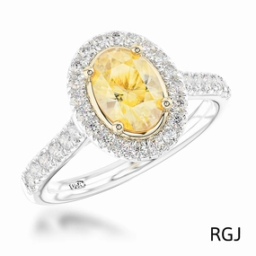 The Skye Platinum And 18ct Yellow Gold 0.71ct Oval Cut Yellow Diamond Engagement Ring With 0.33ct Diamond Halo And Diamond Set Shoulders