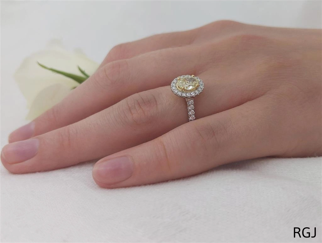 The Skye Platinum And 18ct Yellow Gold 0.71ct Oval Cut Yellow Diamond Engagement Ring With 0.33ct Diamond Halo And Diamond Set Shoulders