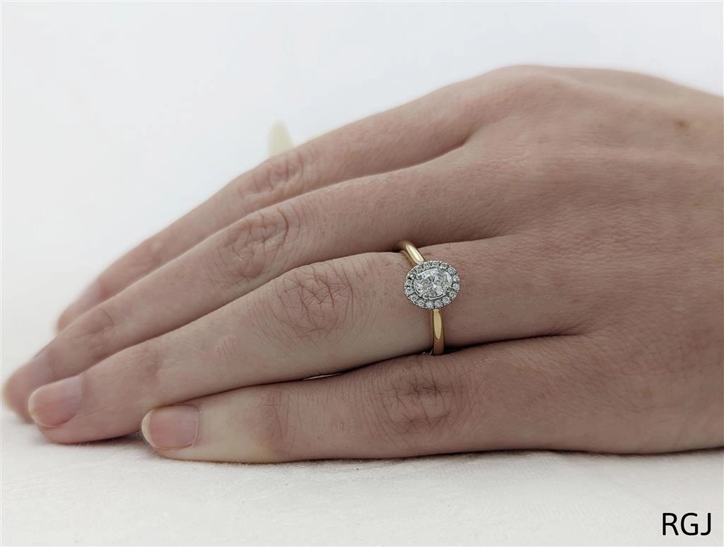 The Skye Pure 18ct Yellow Gold And Platinum 0.30ct Oval Cut Diamond Engagement Ring With 0.15ct Diamond Halo