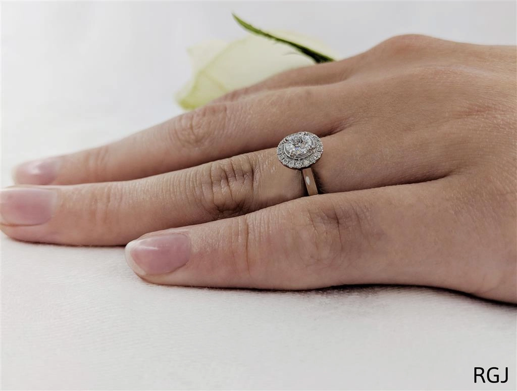 The Skye Pure Platinum 0.40ct Round Brilliant Cut Diamond Engagement Ring With 0.12ct Diamond Halo
