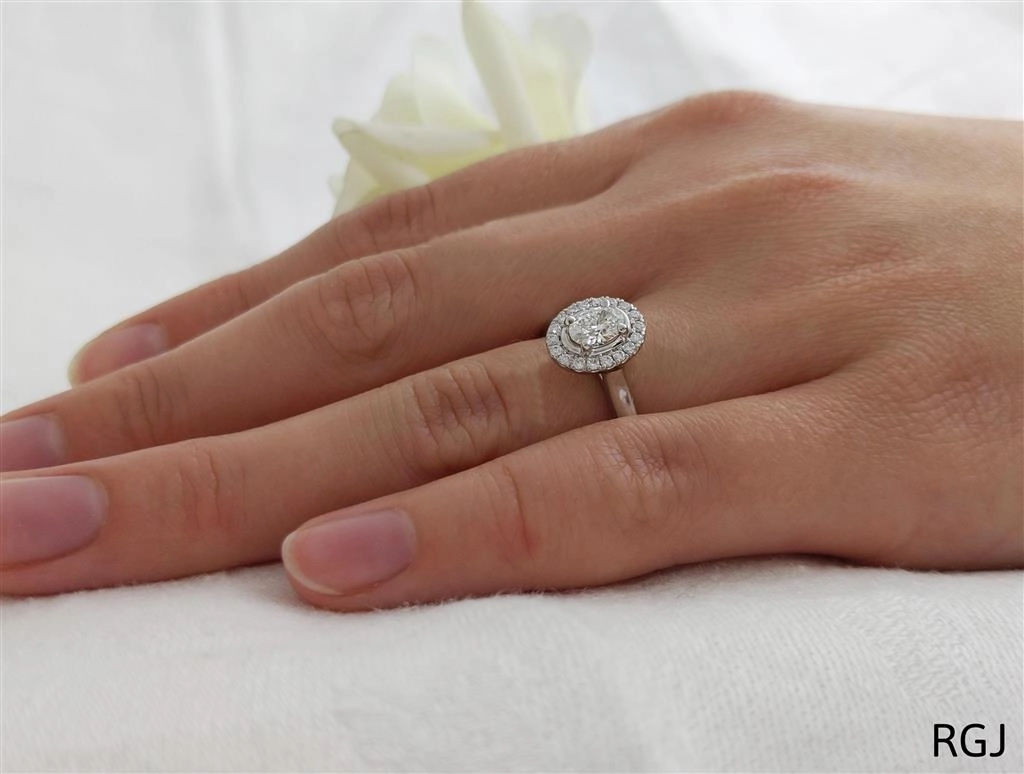 The Skye Pure Platinum 0.43ct Oval Cut Diamond Engagement Ring With 0.15ct Diamond Halo