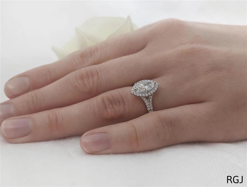 The Skye Saturn Platinum 0.45ct Marquise Cut Diamond Engagement Ring With 0.31ct Diamond Halo And Diamond Set Split Shoulders