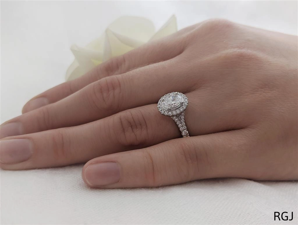 The Skye Saturn Platinum 0.50ct Oval Cut Diamond Engagement Ring With 0.30ct Diamond Halo And Diamond Set Split Shoulders