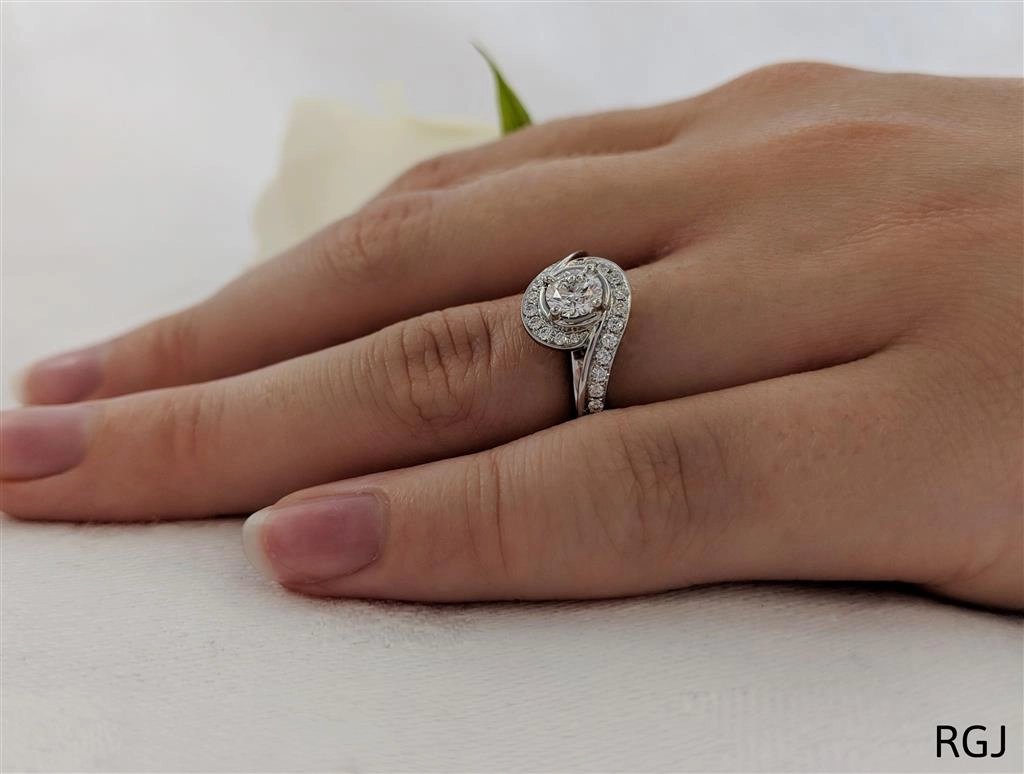 The Tiree Platinum 0.40ct Round Brilliant Cut Diamond Engagement Ring With 0.29ct Diamond Halo And Diamond Set Shoulders
