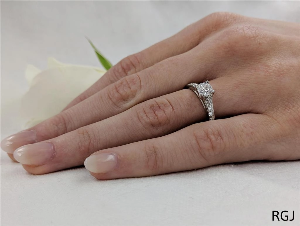 The Valentia Platinum 0.42ct Round Brilliant Cut Diamond Solitaire Engagement Ring With 0.22ct Diamond Set Shoulders