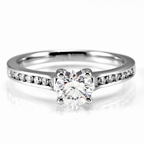 The Waterlily Platinum Round Brilliant Cut Diamond Solitaire Engagement Ring With Diamond Set Shoulders