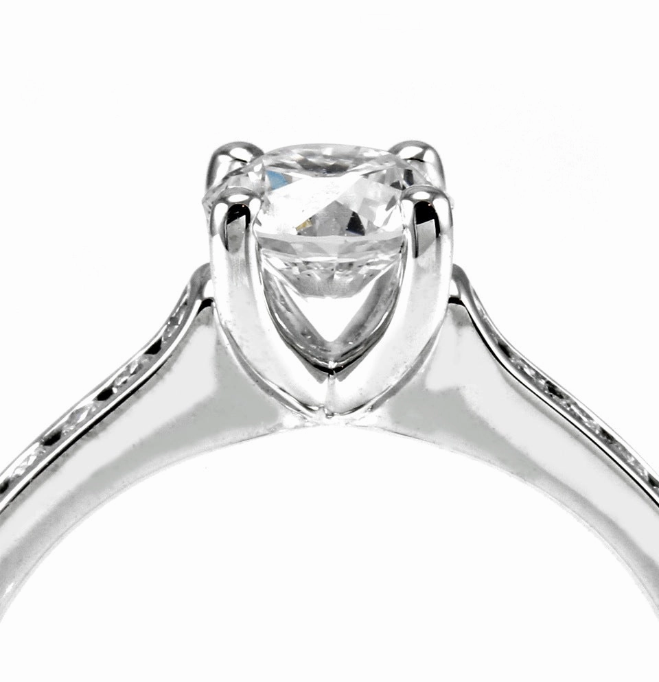 The Waterlily Platinum Round Brilliant Cut Diamond Solitaire Engagement Ring With Diamond Set Shoulders