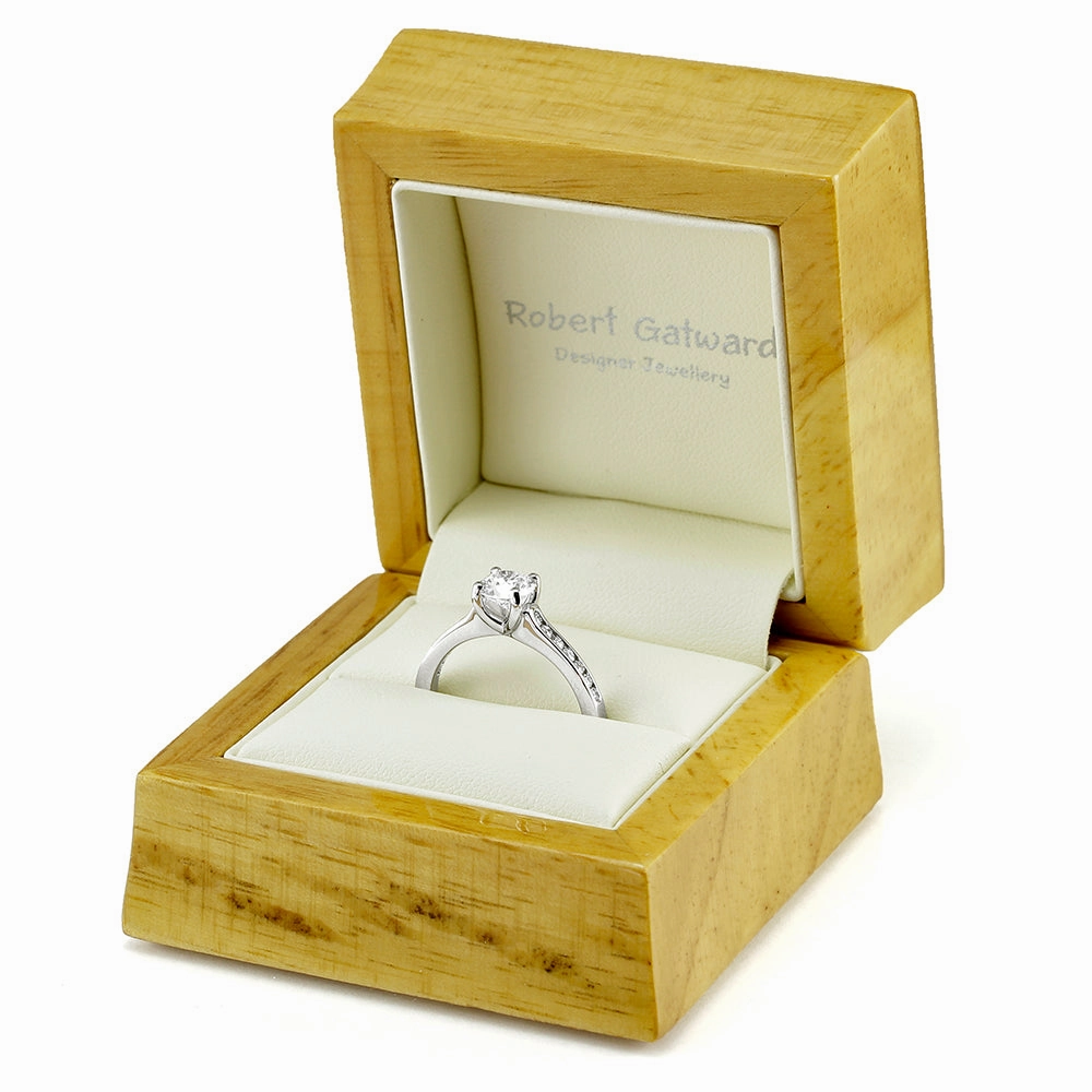 The Waterlily Platinum Round Brilliant Cut Diamond Solitaire Engagement Ring With Diamond Set Shoulders